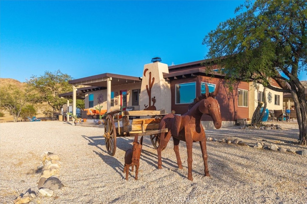 4565 Rock Corral Road Johnson Valley, CA 92285 - Photo 53 of 75 a view of a house with backyard porch and sitting area