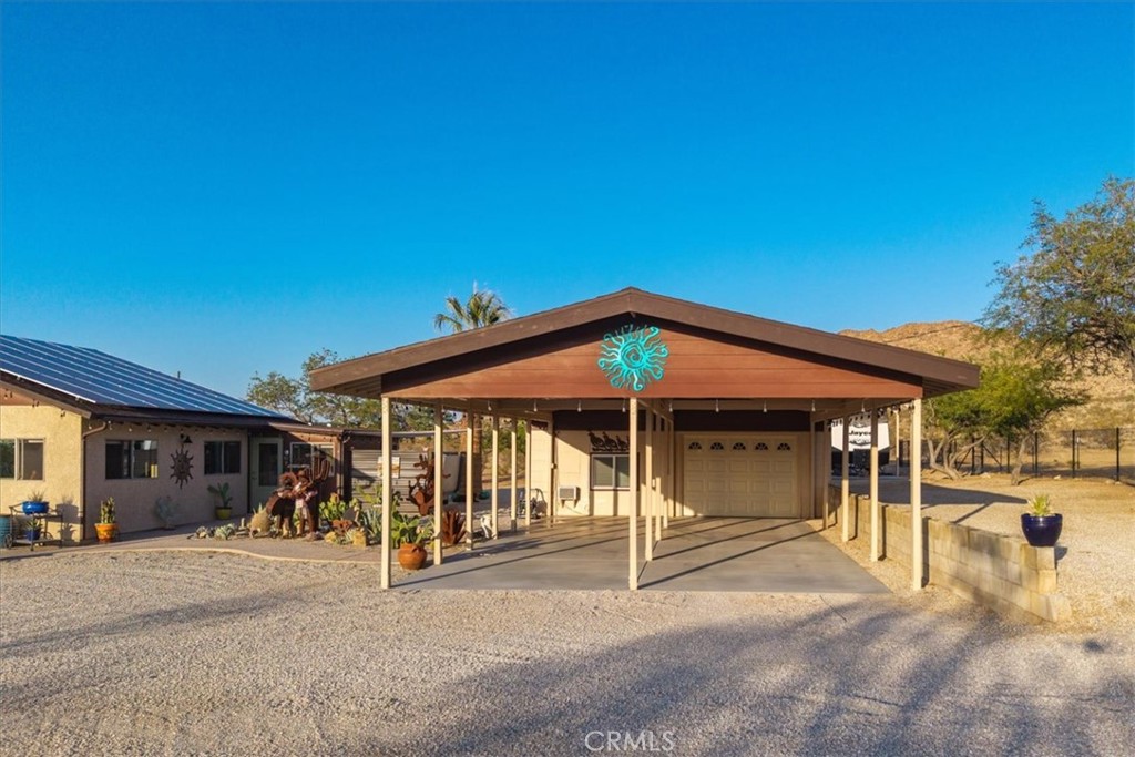 4565 Rock Corral Road Johnson Valley, CA 92285 - Photo 61 of 75 a view of a house with backyard and porch
