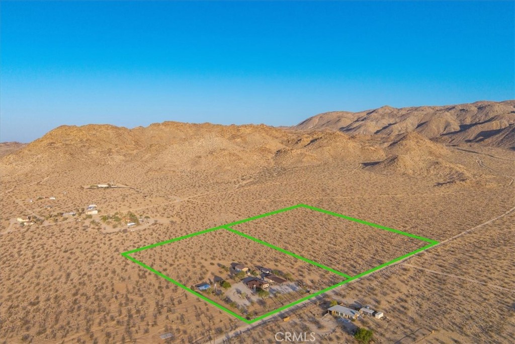 4565 Rock Corral Road Johnson Valley, CA 92285 - Photo 73 of 75 a view of a large building with mountains in the background