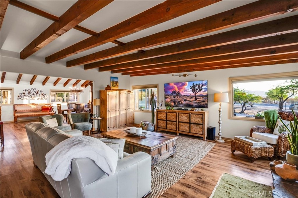 4565 Rock Corral Road Johnson Valley, CA 92285 - Photo 9 of 75 a living room with furniture a rug and a floor to ceiling window