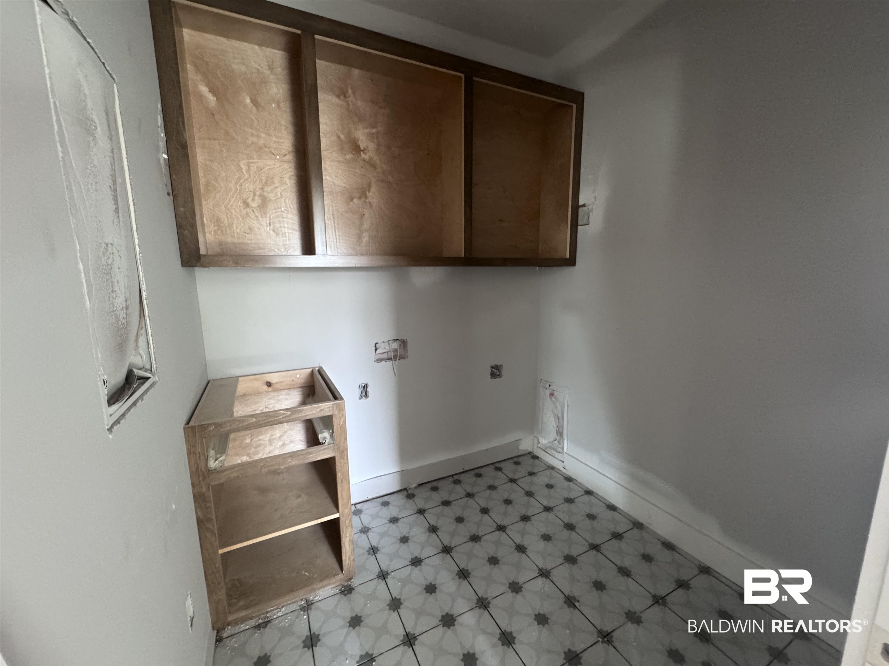 27371 Patch Pl Loop Daphne, AL 36526 - Photo 28 of 63 Laundry room featuring light floors and cabinet space