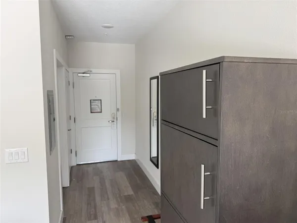 a view of a livingroom with wooden floor