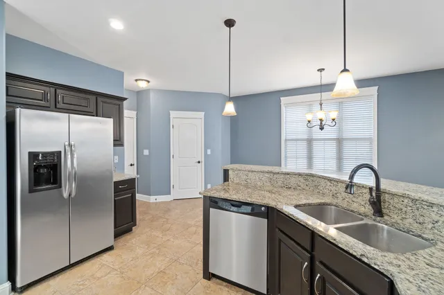 a bathroom with a sink vanity mirror and toilet