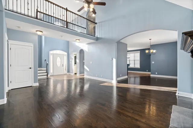 a view of an entryway with wooden floor