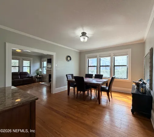 a kitchen with stainless steel appliances granite countertop a sink a stove top oven a counter space and cabinets