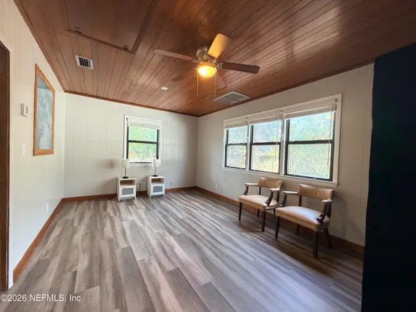 a living room with furniture rug and window