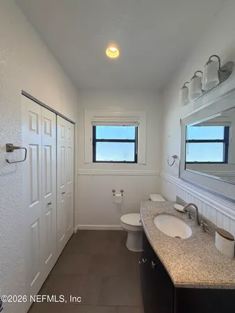 a bathroom with a shower and a sink
