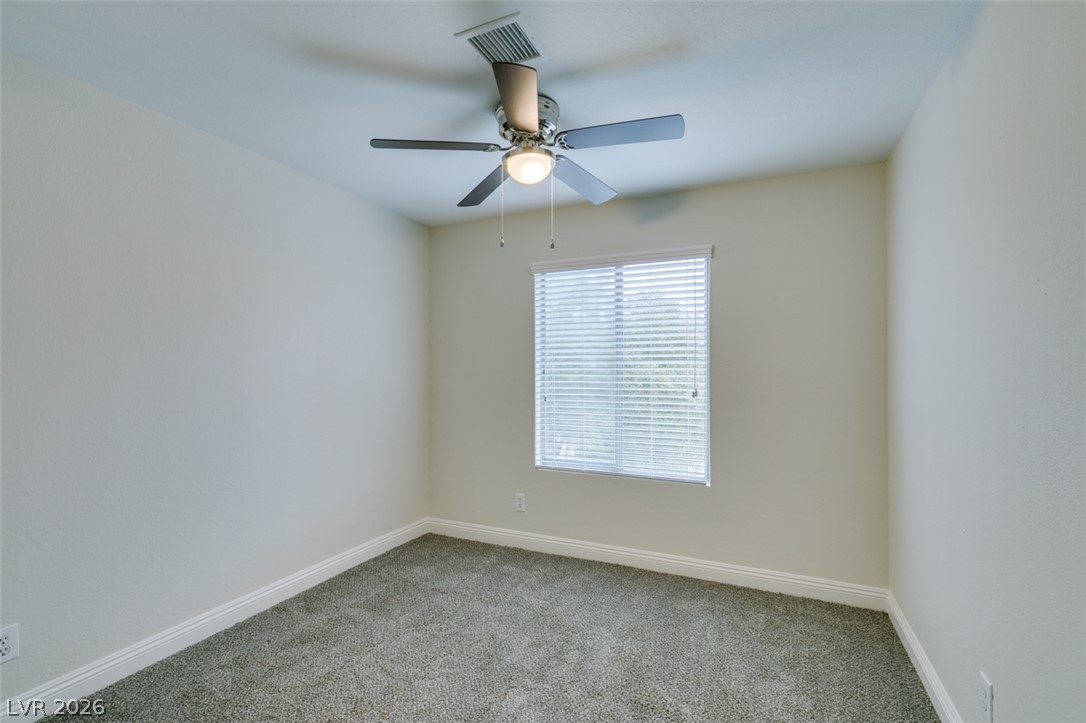1738 Toltec Circle Henderson, NV 89014 - Photo 32 of 46 An inviting room with soft carpeting and ample overhead lighting awaits your personal touch.