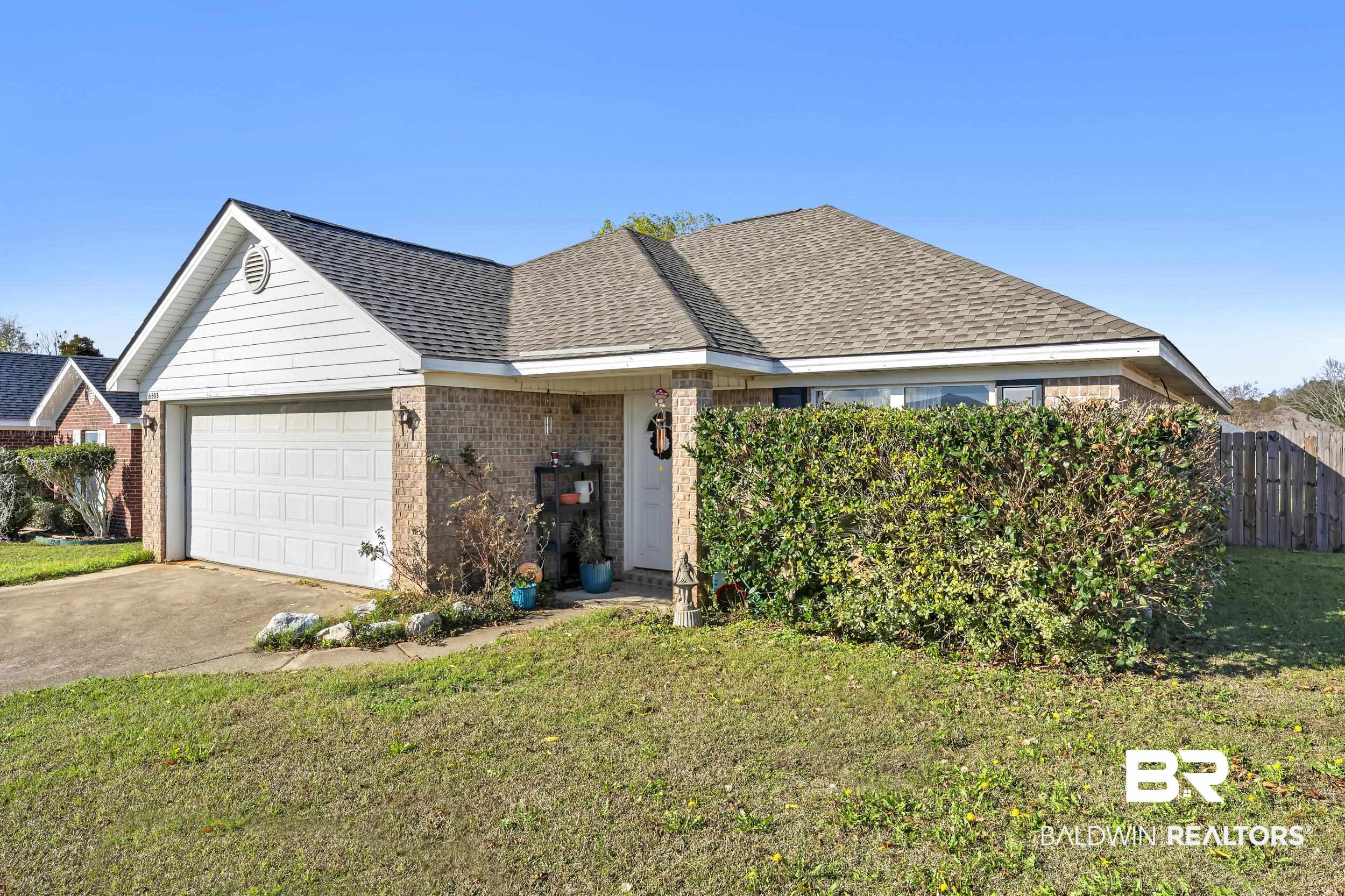 16603 Vanilla Drive Foley, AL 36535 - Photo 2 of 19 Ranch-style house with brick siding, roof with shingles, concrete driveway, and an attached garage