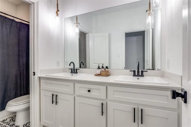a bathroom with a sink and a toilet