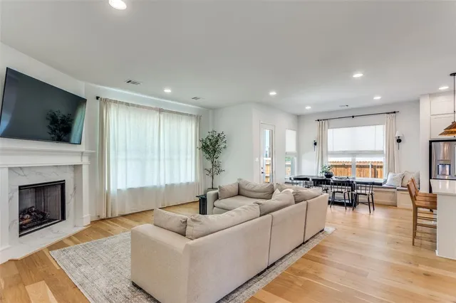 a living room with furniture fireplace and flat screen tv