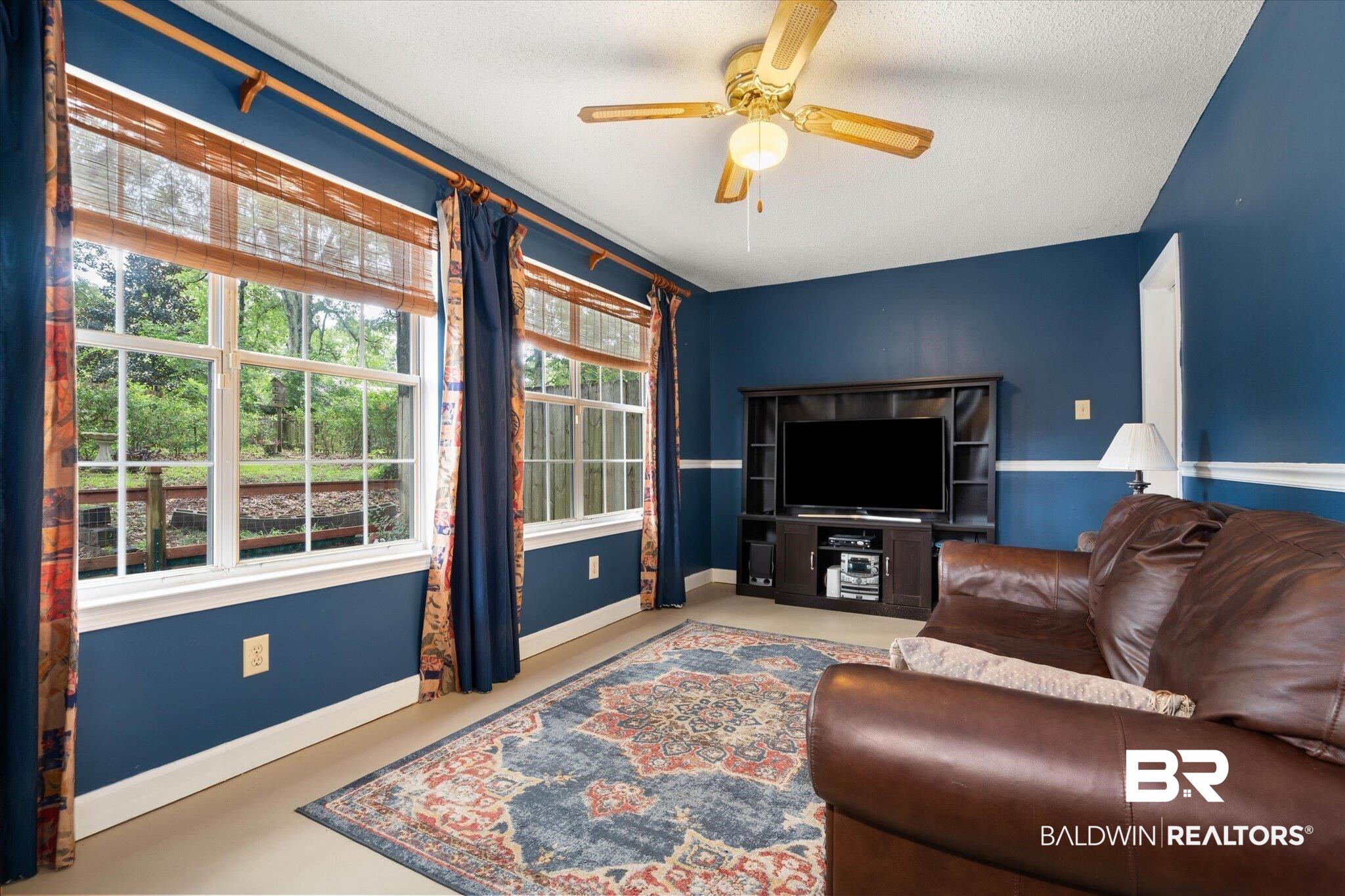 6632 Autumn Ridge Drive Mobile, AL 36695 - Photo 5 of 22 Den area featuring healthy amount of natural light and a ceiling fan