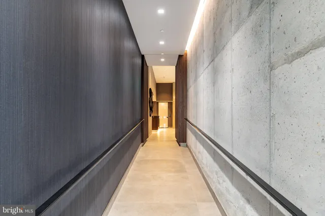 a bedroom with a large bed and a large window