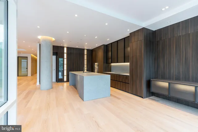 a living room with couches and a flat screen tv