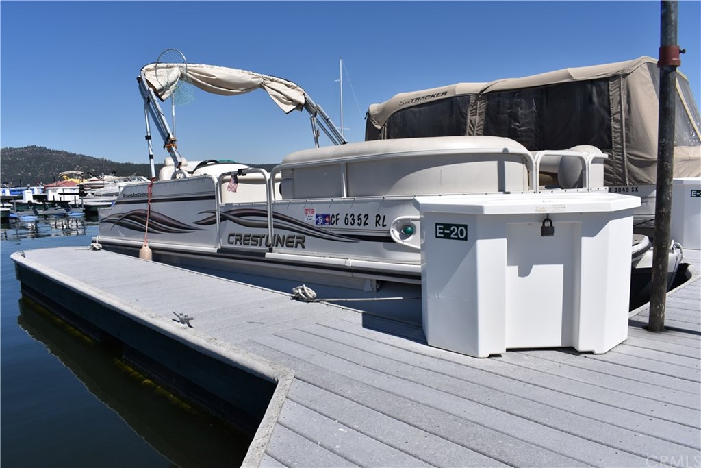 a view of a patio with table and chairs