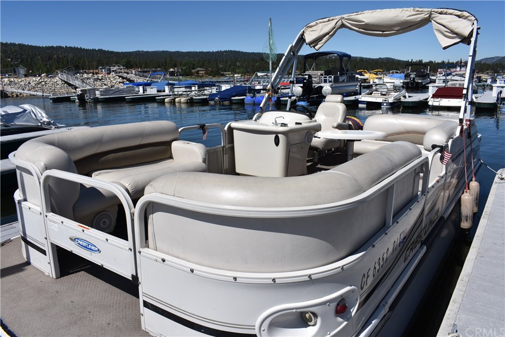 400 Pine Knot Avenue, Unit E20 Big Bear Lake, CA 92315 - Photo 7 of 17 a view of a swimming pool with outdoor seating
