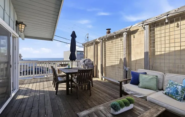 a view of balcony with furniture