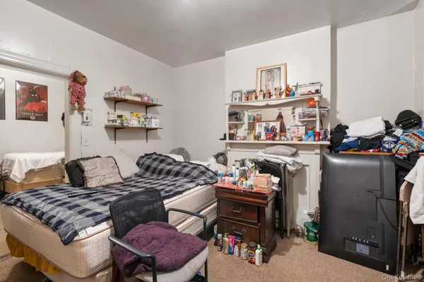 a bedroom with furniture and a bed