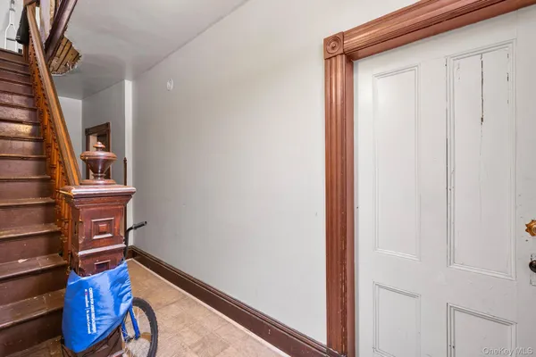 a view of an entryway with wooden floor