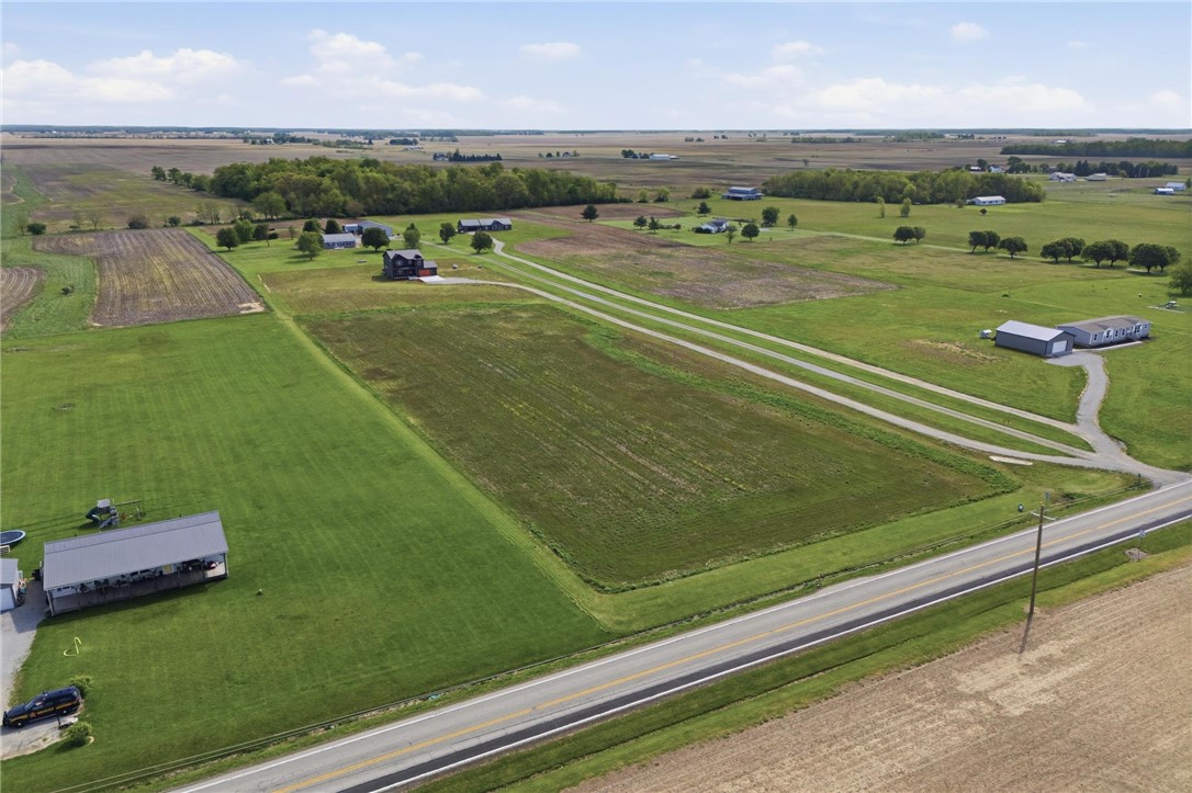 3509 South State Rte 72 Sabina, OH 45169 - Photo 41 of 44 Expansive green fields and open skies define this tranquil rural landscape, perfect for serene living.