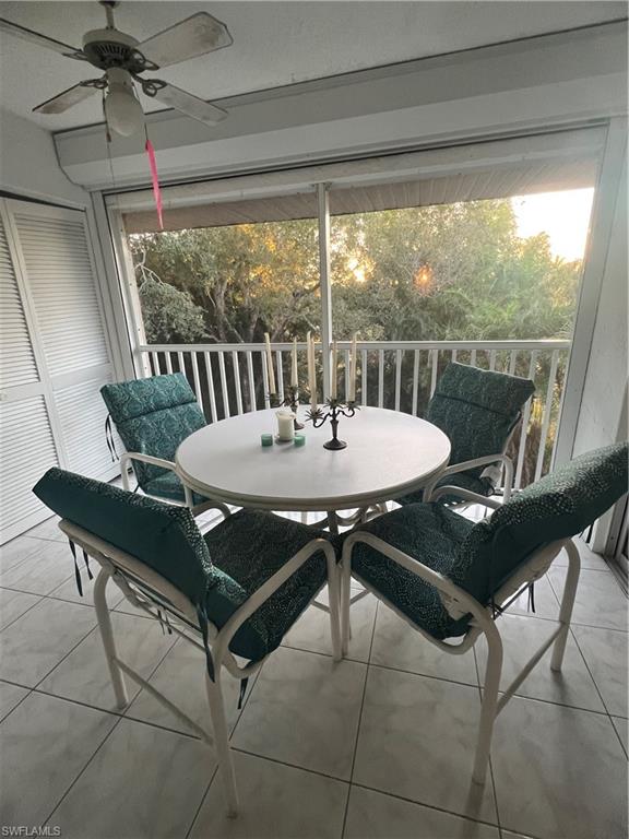 5419 Rattlesnake Hammock Road, Unit 306F Naples, FL 34113 - Photo 16 of 18 a view of a dining room with furniture window and outside view