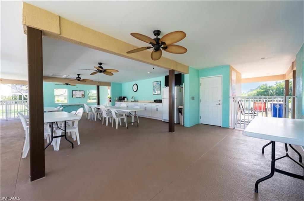 5419 Rattlesnake Hammock Road, Unit 306F Naples, FL 34113 - Photo 17 of 18 a dining room with furniture and a large window