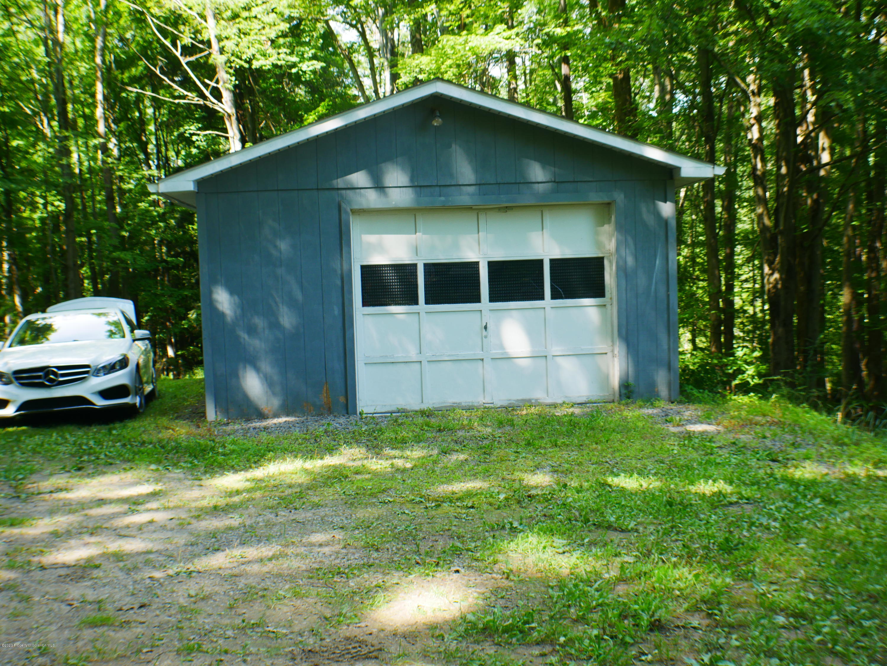 1404 Barrett Road Susquehanna, PA 18847 - Photo 2 of 15 a view of a back yard of the house