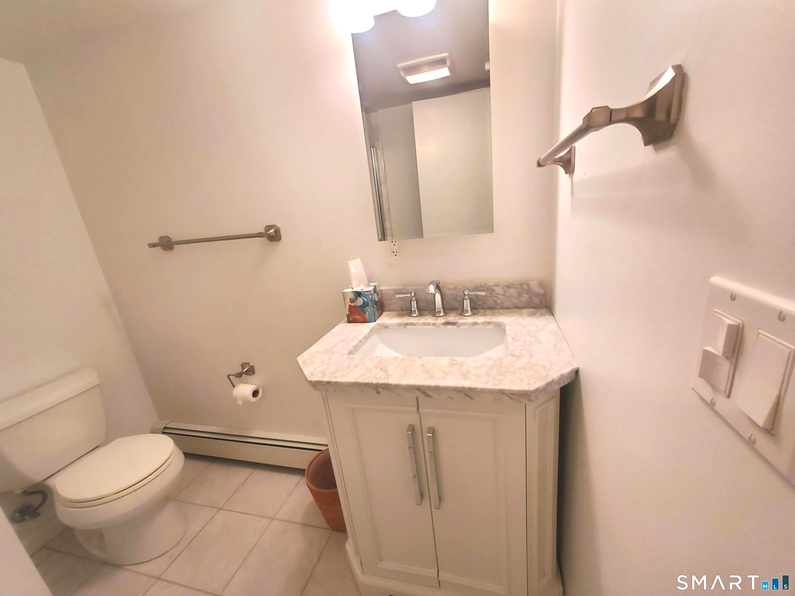 42 County Street Norwalk, CT 06851 - Photo 19 of 21 a bathroom with a sink a toilet and shower