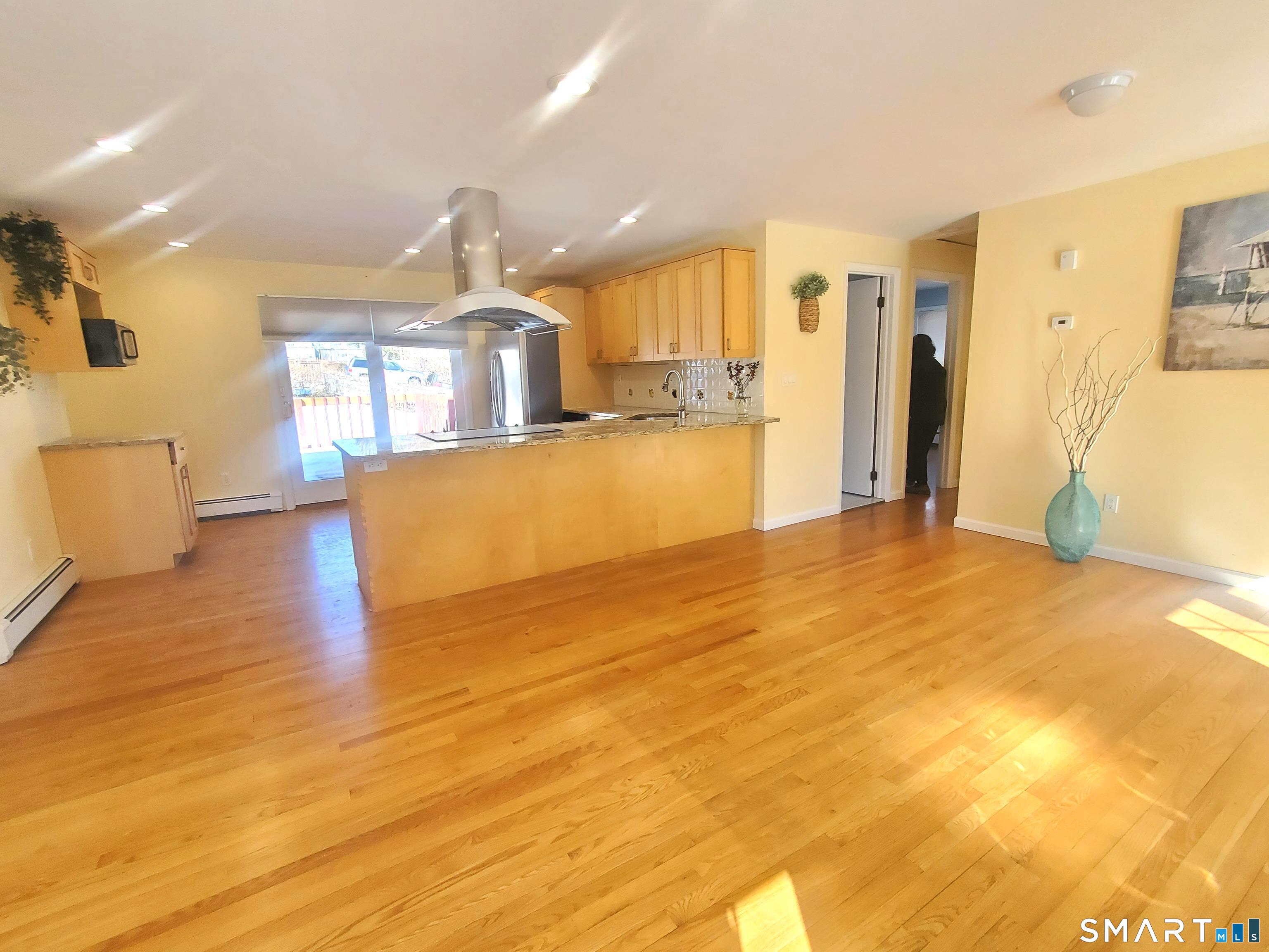 42 County Street Norwalk, CT 06851 - Photo 2 of 21 a view of a kitchen and a chandelier