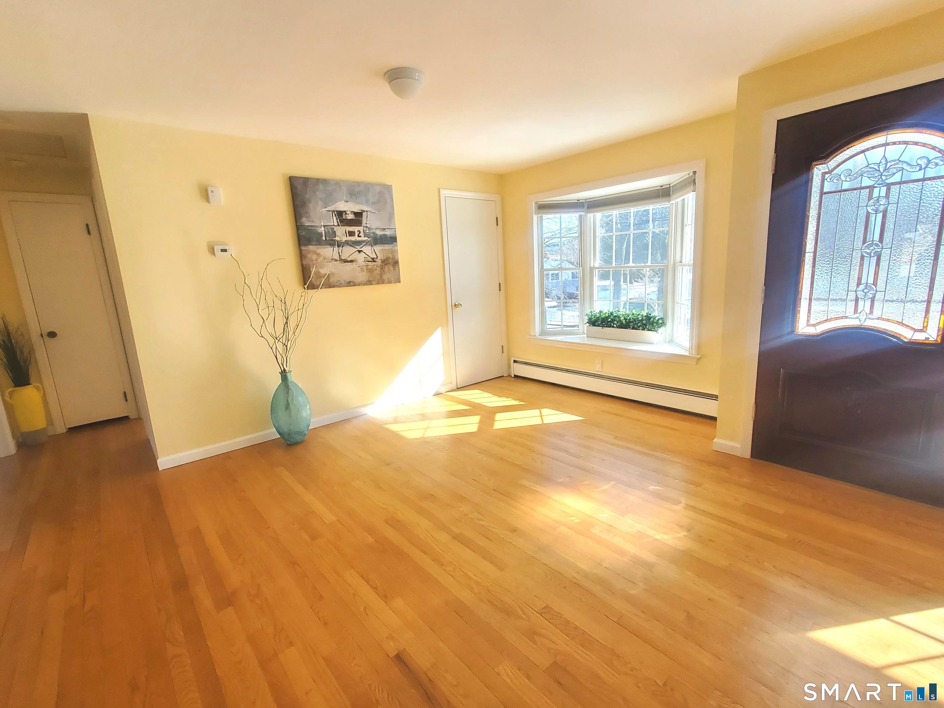 42 County Street Norwalk, CT 06851 - Photo 6 of 21 a view of an empty room with a window