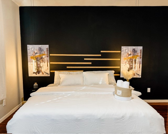 2727 Sunbird Drive Houston, TX 77084 - Photo 12 of 34 a bedroom with a bed and a night stand