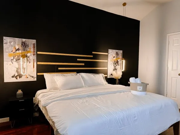 a large white bed in a white room