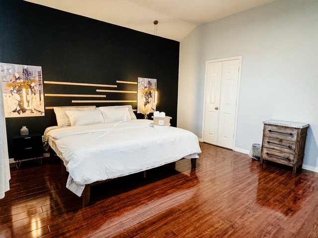 2727 Sunbird Drive Houston, TX 77084 - Photo 15 of 34 a bedroom with a bed and wooden floor