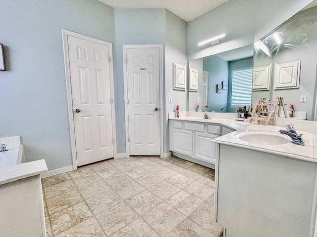 2727 Sunbird Drive Houston, TX 77084 - Photo 17 of 34 a bathroom with a sink double vanity and a mirror
