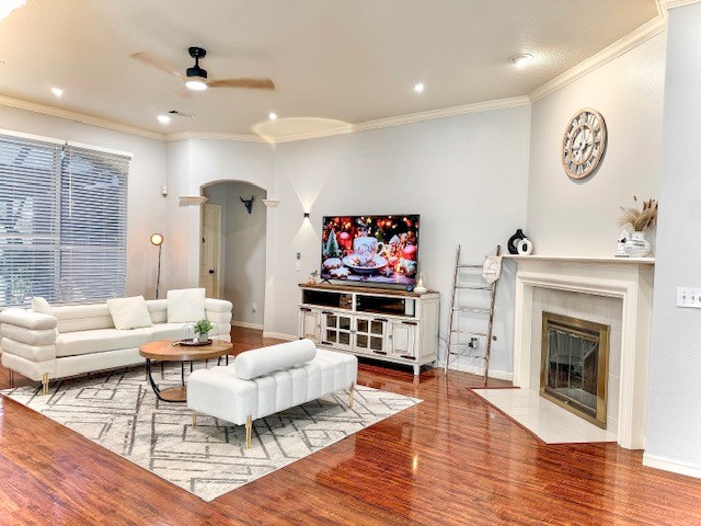 2727 Sunbird Drive Houston, TX 77084 - Photo 2 of 34 a living room with furniture a fireplace and a flat screen tv