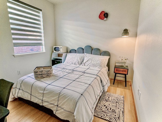 2727 Sunbird Drive Houston, TX 77084 - Photo 30 of 34 a bedroom with a bed and a window