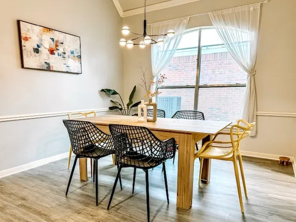 a kitchen with kitchen island granite countertop appliances cabinets and a sink