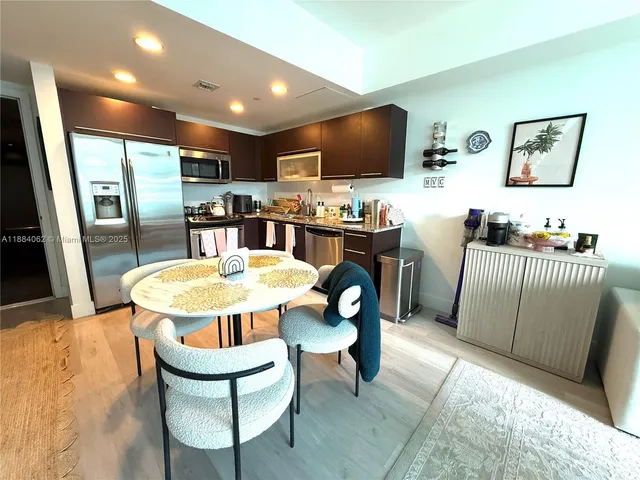 a swimming pool with outdoor seating and trees