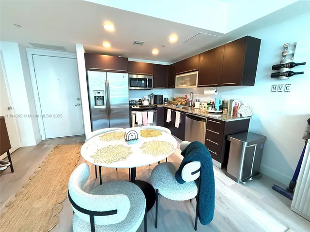 a view of swimming pool with outdoor seating and plants