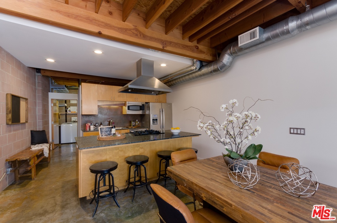 1128 5th Avenue Venice, CA 90291 - Photo 6 of 12 a kitchen with a table and chairs in it