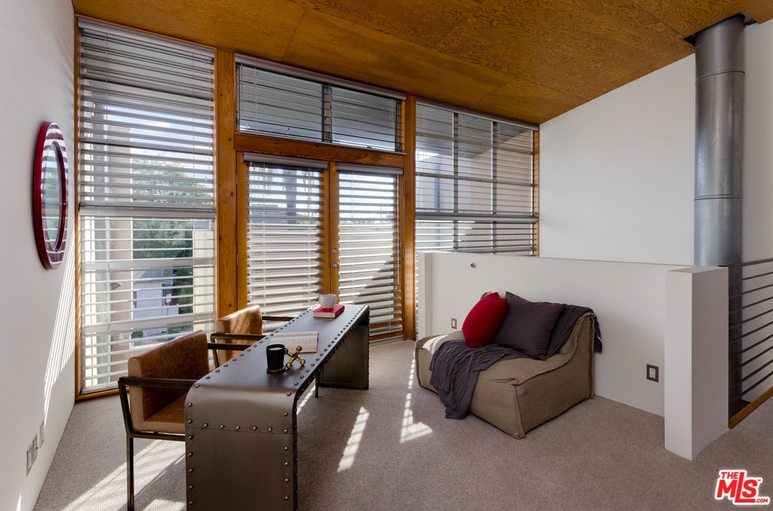 1128 5th Avenue Venice, CA 90291 - Photo 8 of 12 a living room with furniture and a window