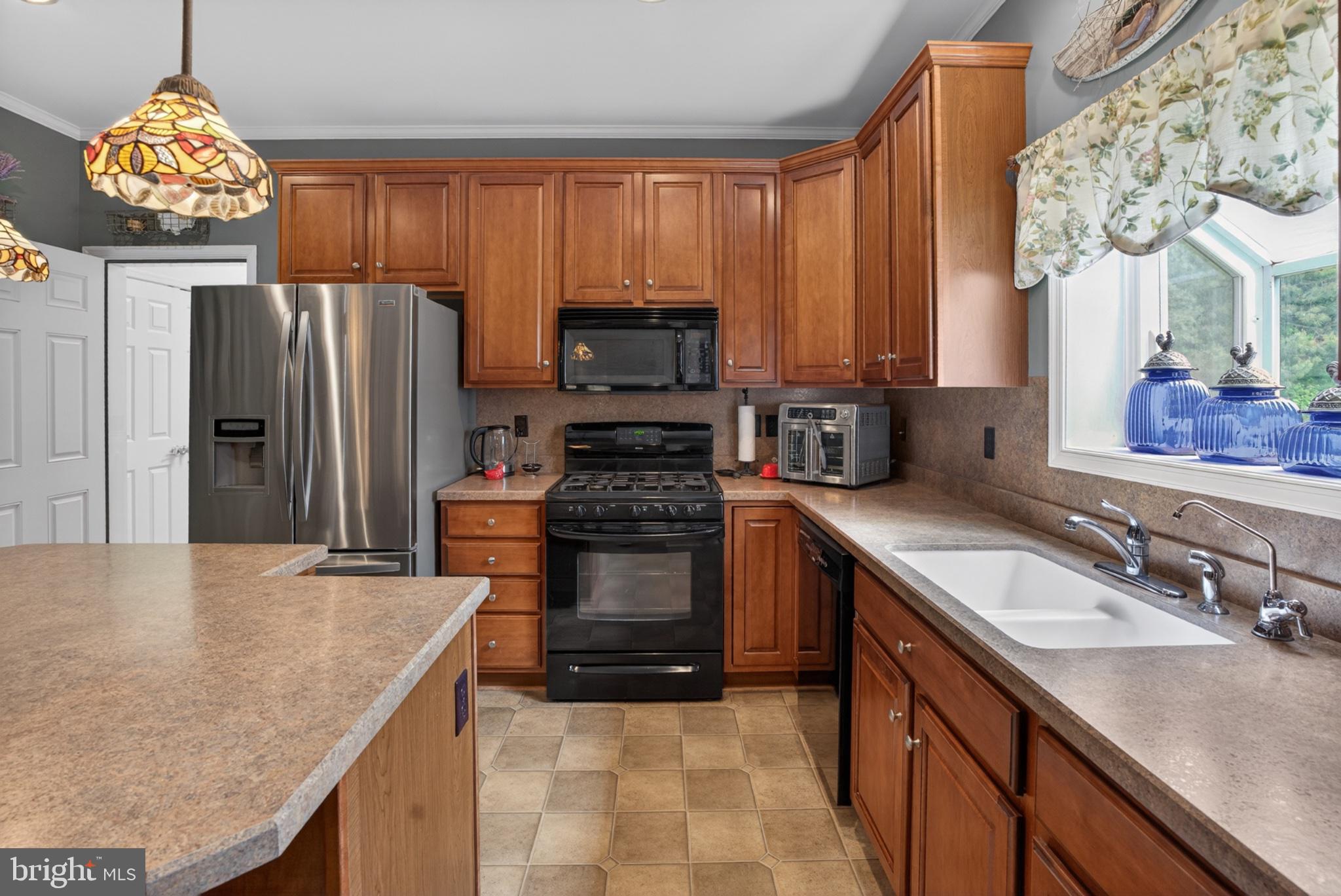 2435 Payne Road Pocomoke City, MD 21851 - Photo 34 of 75 Warm wood tones in a cozy kitchen.