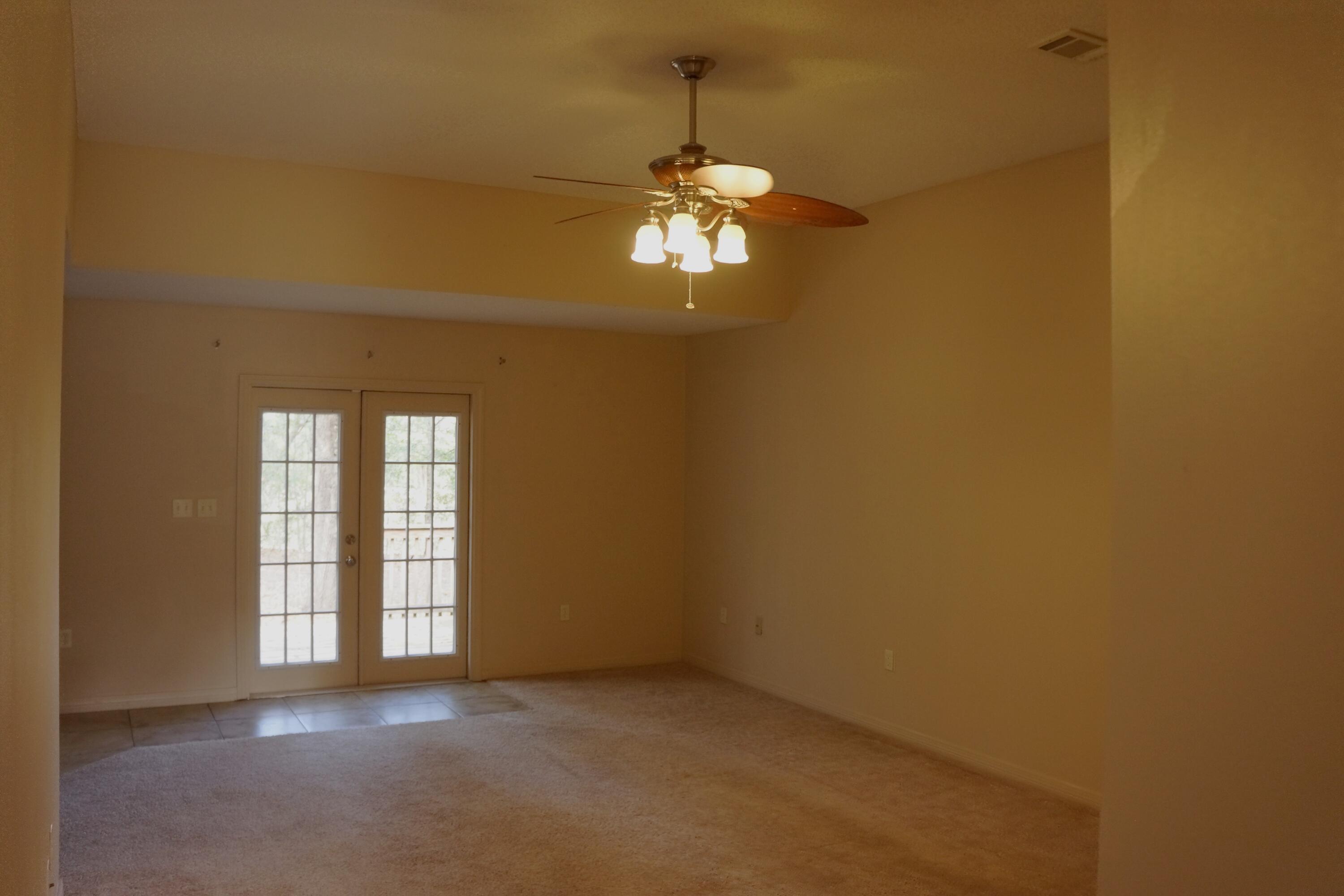 3248 Twilight Drive Crestview, FL 32539 - Photo 2 of 13 a view of a chandelier fan and windows