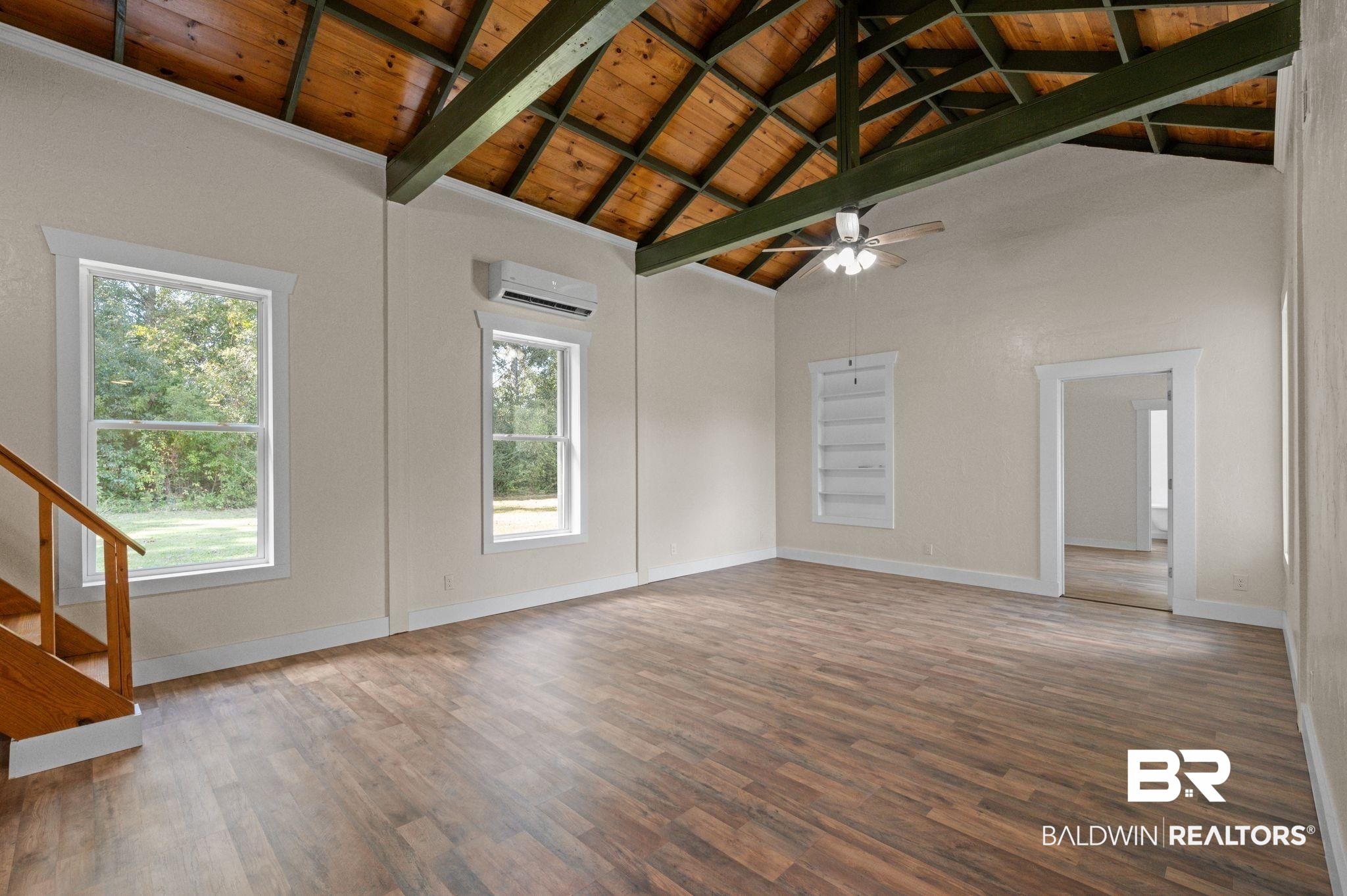 20037 County Road 33 Fairhope, AL 36532 - Photo 43 of 79 Unfurnished living room featuring wood ceiling, wood-type flooring, beam ceiling, and a wall mounted air conditioner