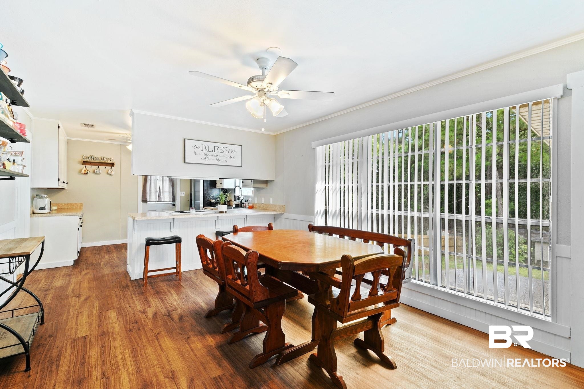 14 Lee Circle Daphne, AL 36527 - Photo 25 of 83 Dining area featuring a healthy amount of sunlight, hardwood / wood-style flooring, ornamental molding, and ceiling fan