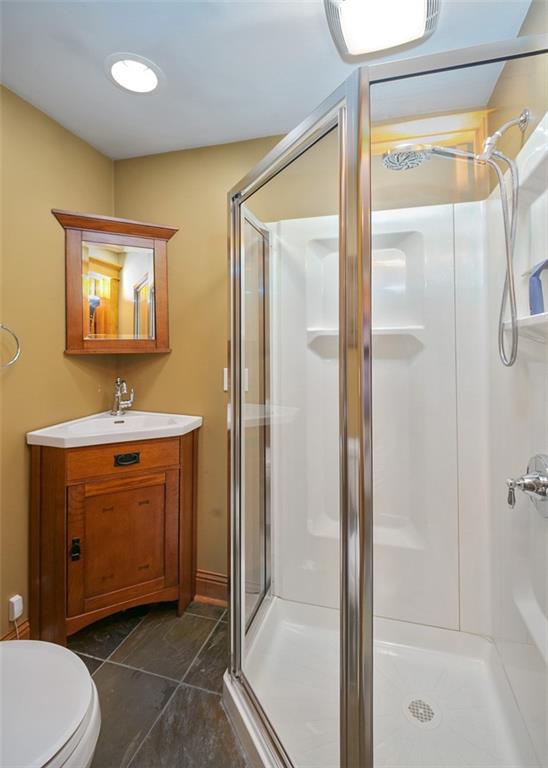 114 Cemetery Road Perryopolis, PA 15473 - Photo 15 of 35 a bathroom with a toilet a sink and shower