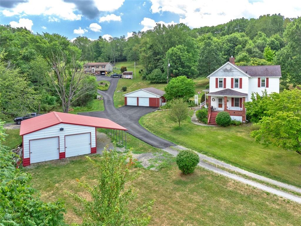 114 Cemetery Road Perryopolis, PA 15473 - Photo 2 of 35 a aerial view of a house with yard and green space