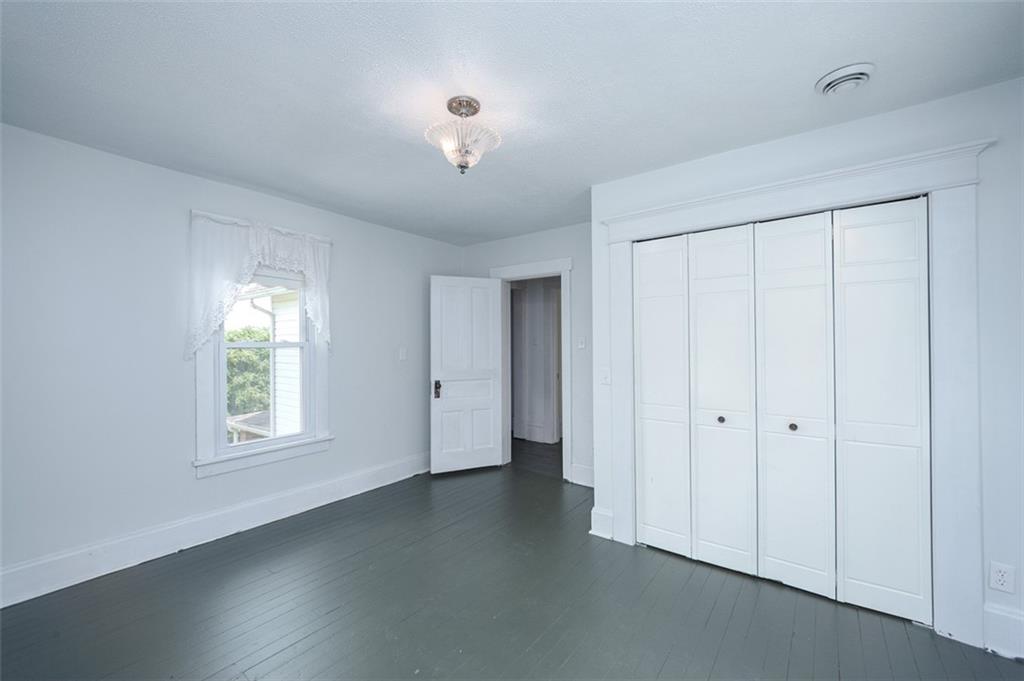 114 Cemetery Road Perryopolis, PA 15473 - Photo 23 of 35 an empty room with windows and closet