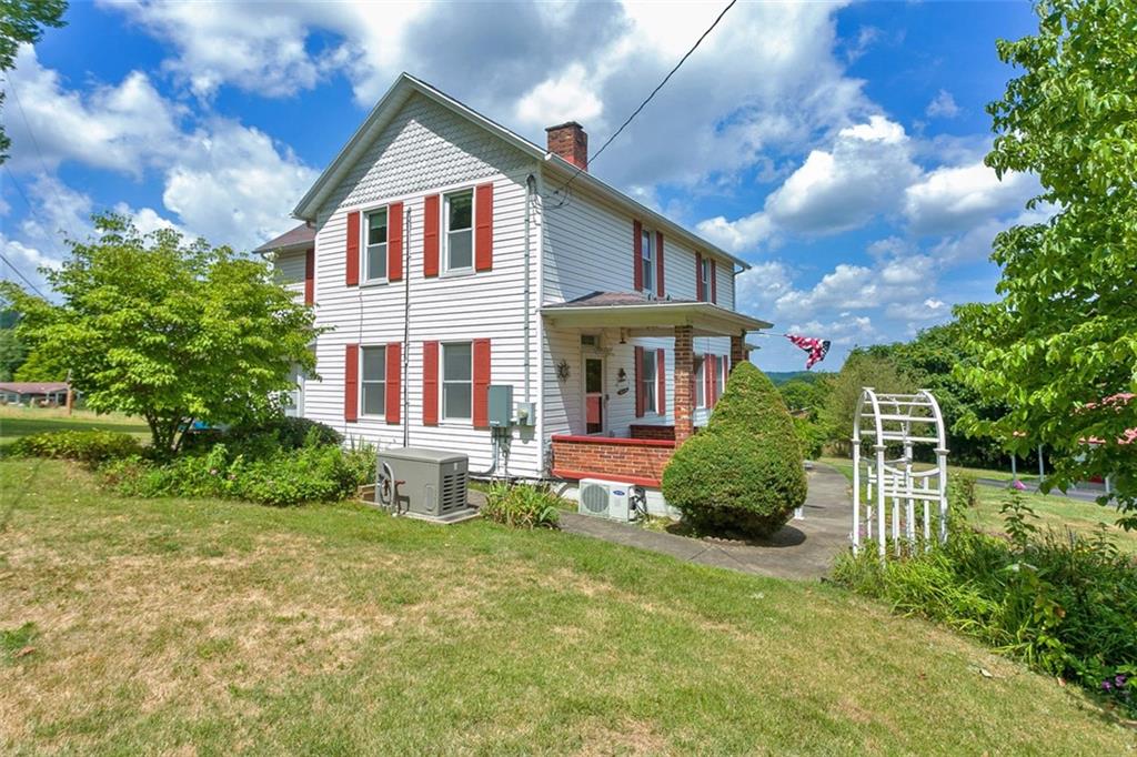 114 Cemetery Road Perryopolis, PA 15473 - Photo 30 of 35 a front view of a house with a yard