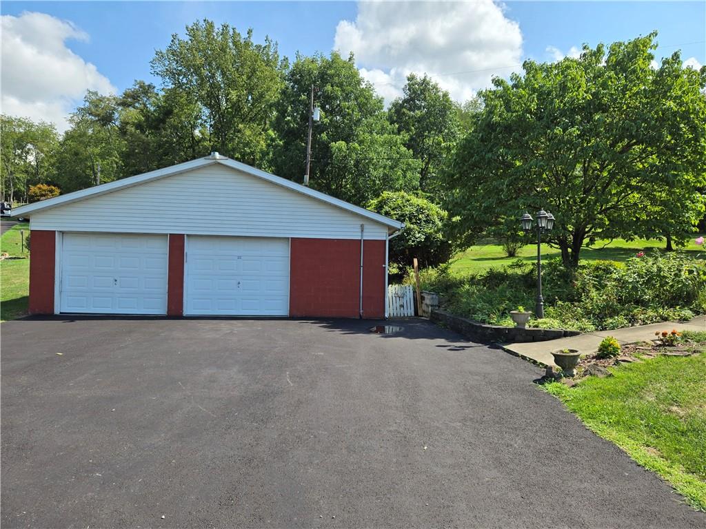 114 Cemetery Road Perryopolis, PA 15473 - Photo 3 of 35 a house with trees in the background